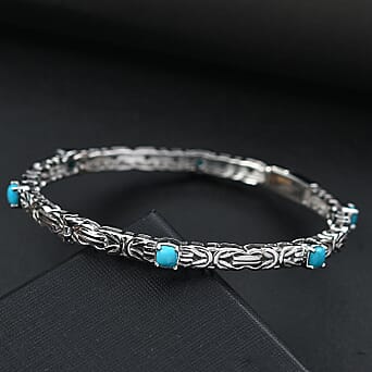 https://tjcuk.sirv.com/Products/80/6/8060554/Sleeping-Beauty-Turquoise-Full-Bangle-in-Rhodium-Overlay-Sterling-Silv_8060554_1 (copy).jpg?w=342&h=342